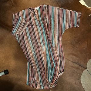 Excellent condition never been worn. Woman’s multi color cover up size small.